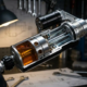Precision shock absorber cutaway displaying internal valving and piston assembly with oil flow dynamics in chrome and black components
